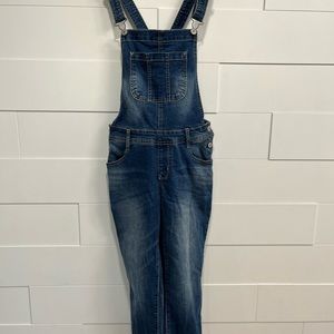 Blue dungarees overall.